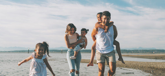 family with young children on a beach