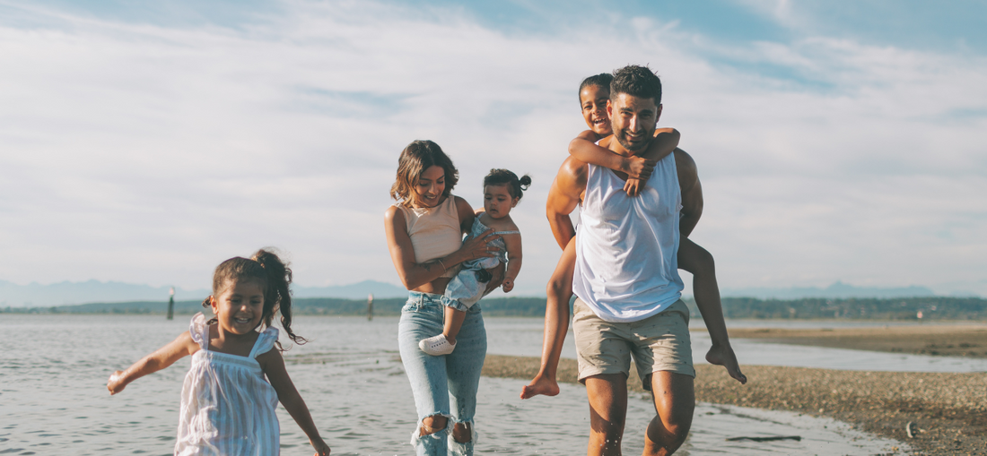 family with young children on a beach